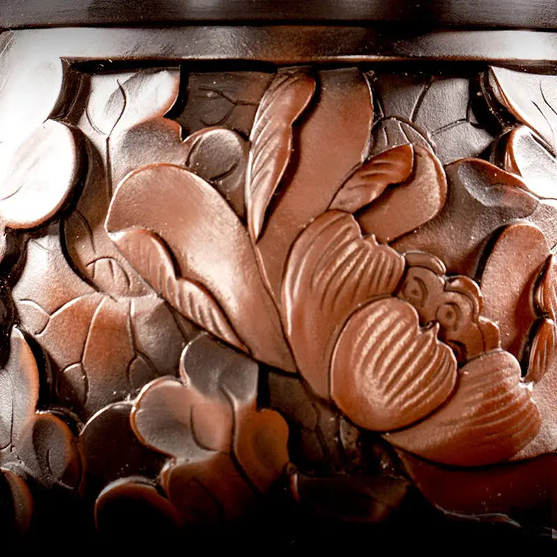 Intricate floral wood carving artwork featuring a lotus flower in purple clay Jianshui Zitao style