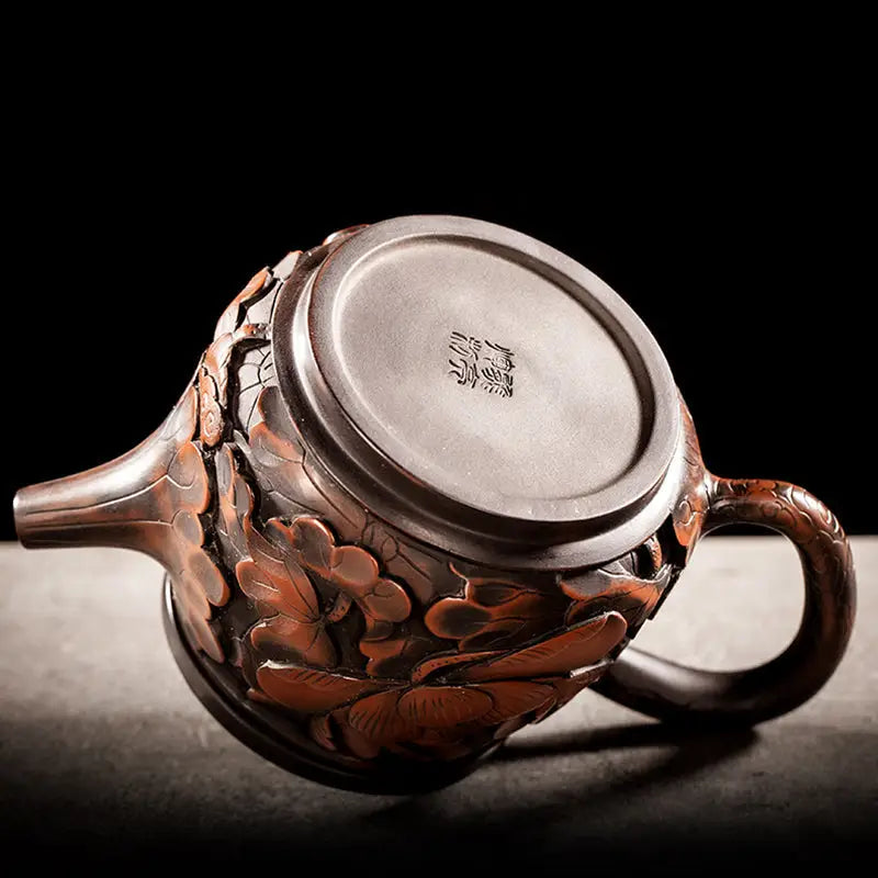 Ornate floral-carved Lotus Flower II teapot in purple clay jianshui zitao style