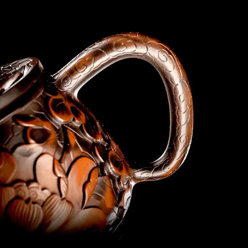 Ornate brown teapot handle from Lotus Flower II made of purple clay Jianshui Zitao