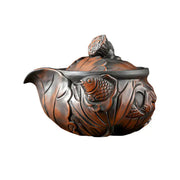 Ornate brown Jianshui Zitao teapot with fish and lotus pod designs