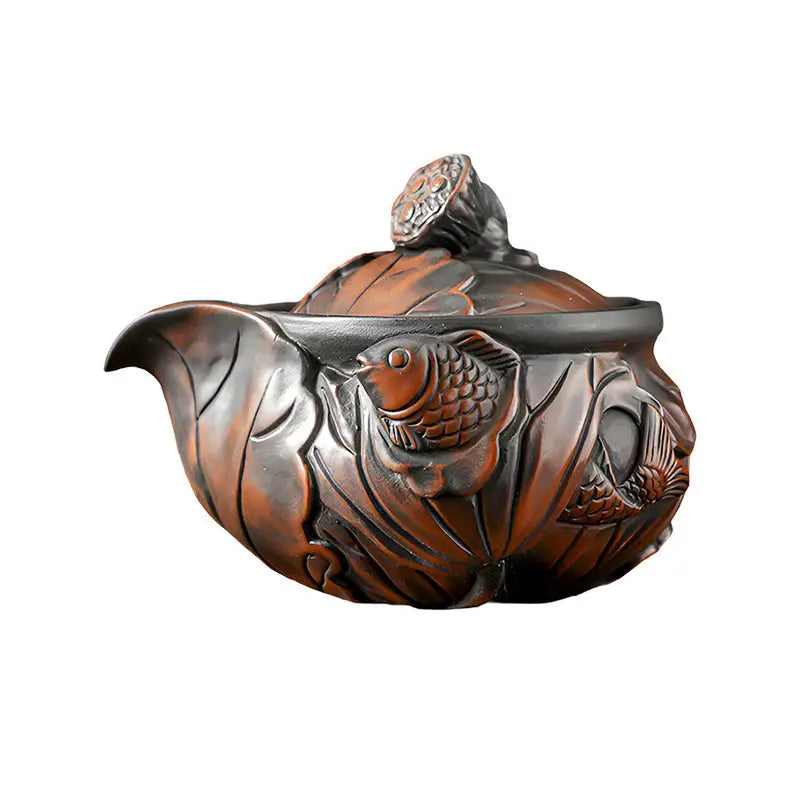 Ornate brown Jianshui Zitao teapot with fish and lotus pod designs