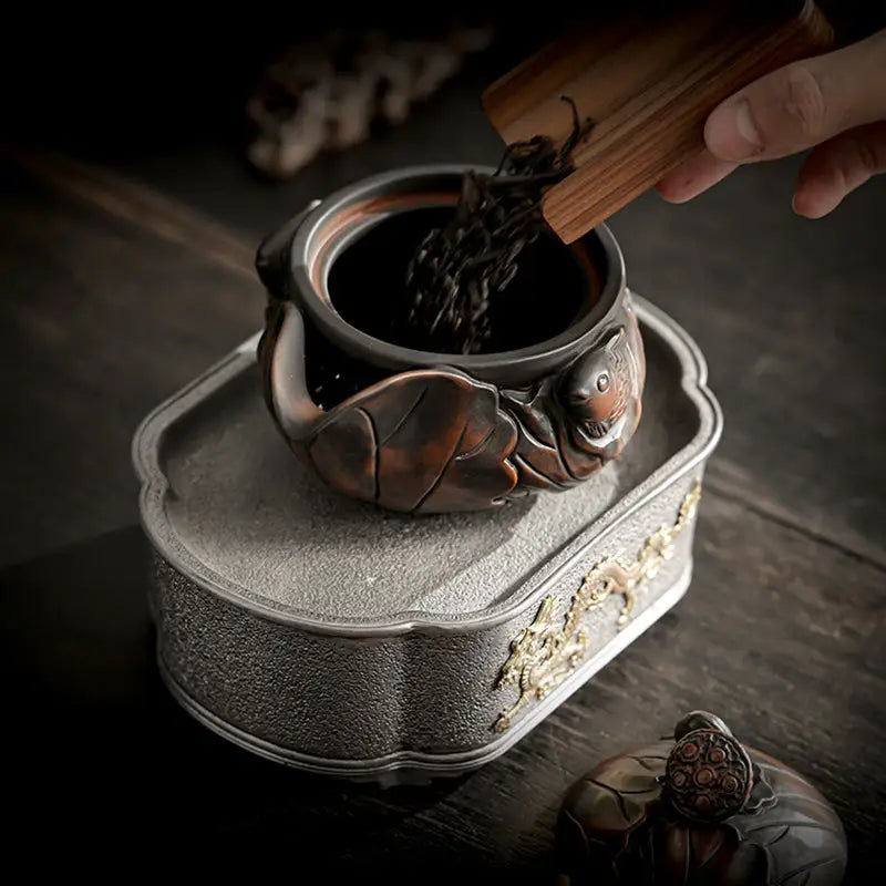 Ornate Lotus Pod Jianshui Zitao teapot with animal motif showcasing intricate craftsmanship