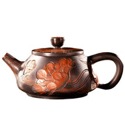 Ornate brown Jianshui Zitao Lotus Pond Zitao Teapot with floral carvings