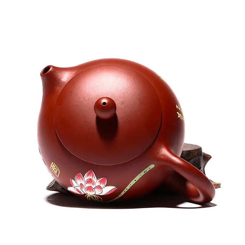 Reddish-brown Yixing Zisha ceramic teapot with hand-painted lotus design in purple clay