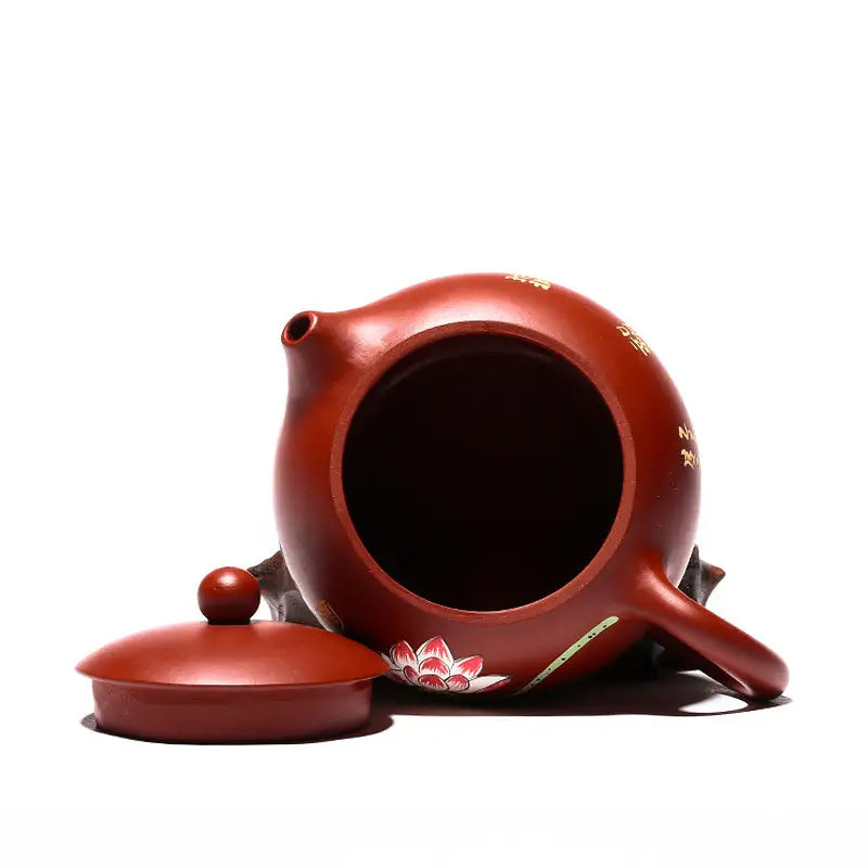 Red-brown ceramic teapot with floral design from Lotus Pond, handcrafted Yixing Zisha purple clay