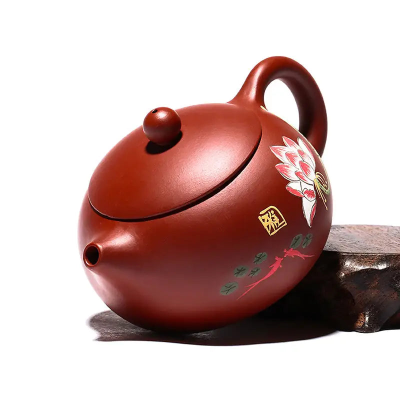 Reddish-brown Yixing Zisha ceramic teapot with hand-painted lotus floral design