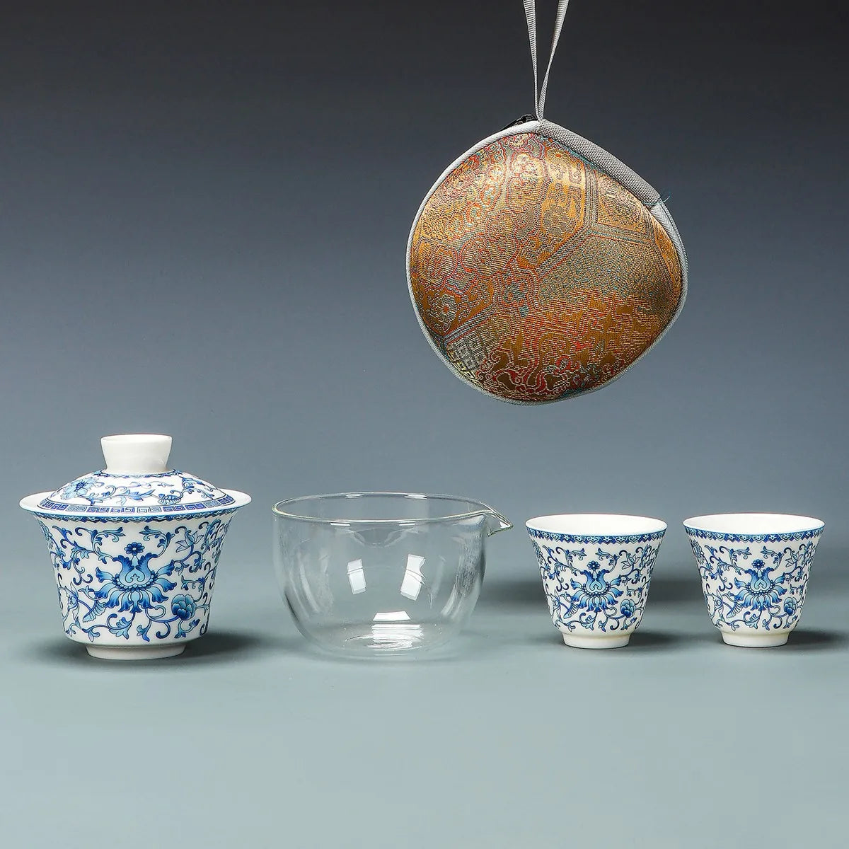 Blue lotus scroll gaiwan travel tea set with glass pitcher, cups and round case – photo 1