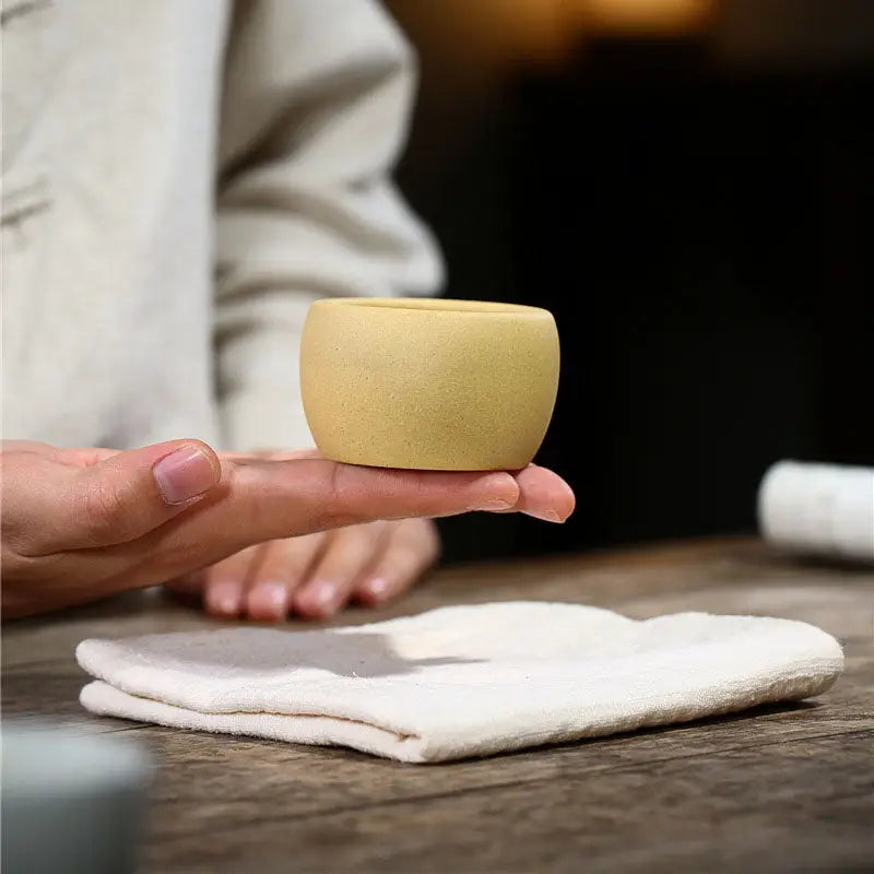 Small yellow ceramic Lotus Serenity yixing zisha teacup with poetic calligraphy design