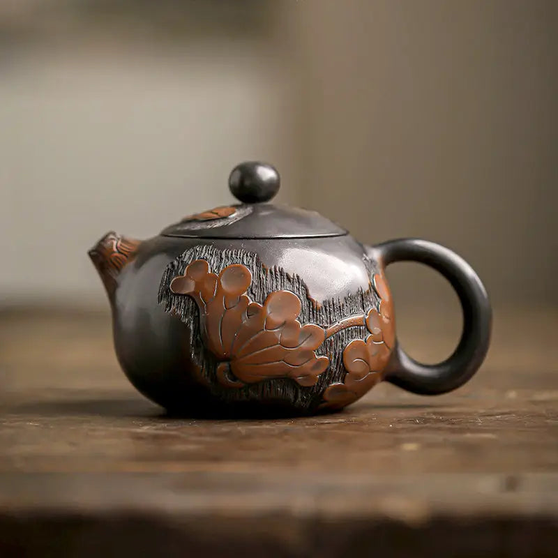 Dark floral-embossed Zisha Clay Lotus Teapot with Hand-Carved Lotus Design