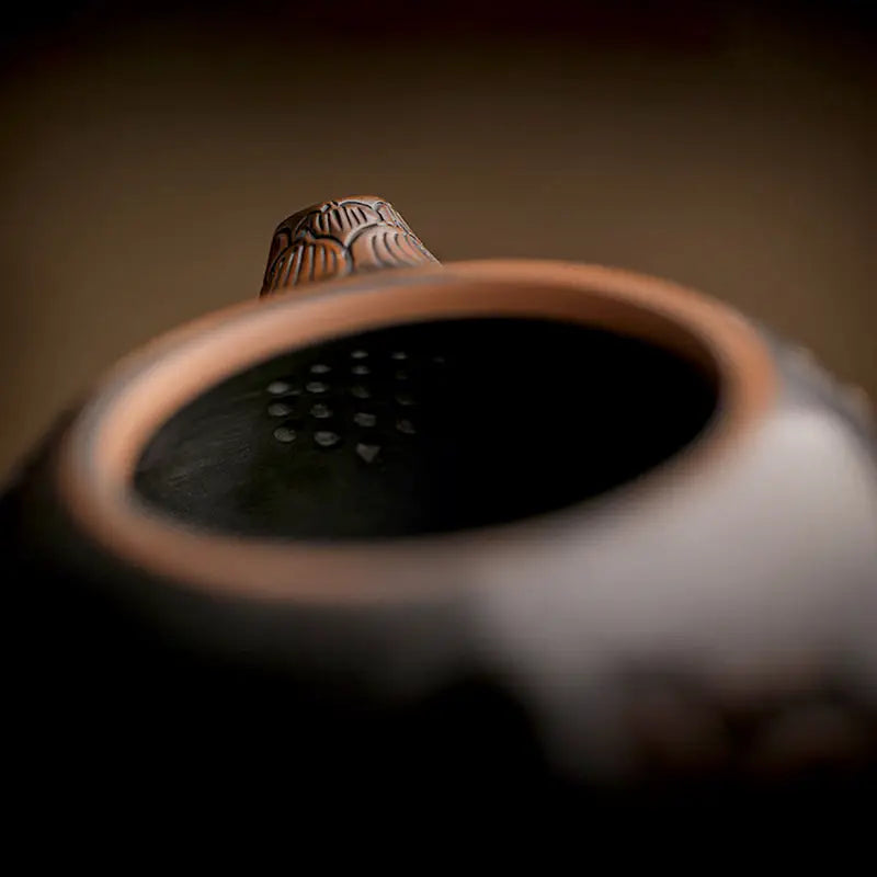 Dark Zisha clay Lotus teapot with hand-carved lotus design and decorative lid