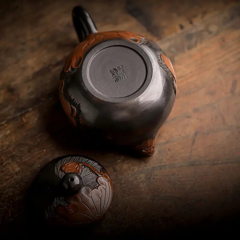 Dark ornate Zisha clay Lotus teapot with lid, featuring hand-carved lotus design