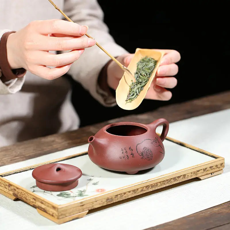 Reddish-brown Lotus Whisper Yixing Teapot with Lid and Bamboo Tea Scoop featuring Lotus Pods