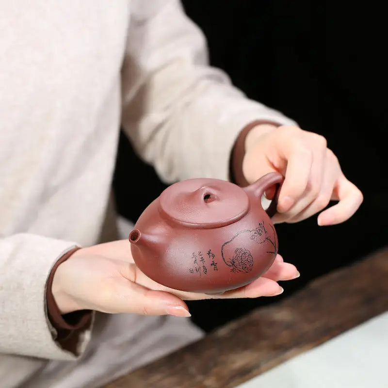 Reddish-brown Lotus Whisper Yixing Teapot with lotus pods design for elegant brewing