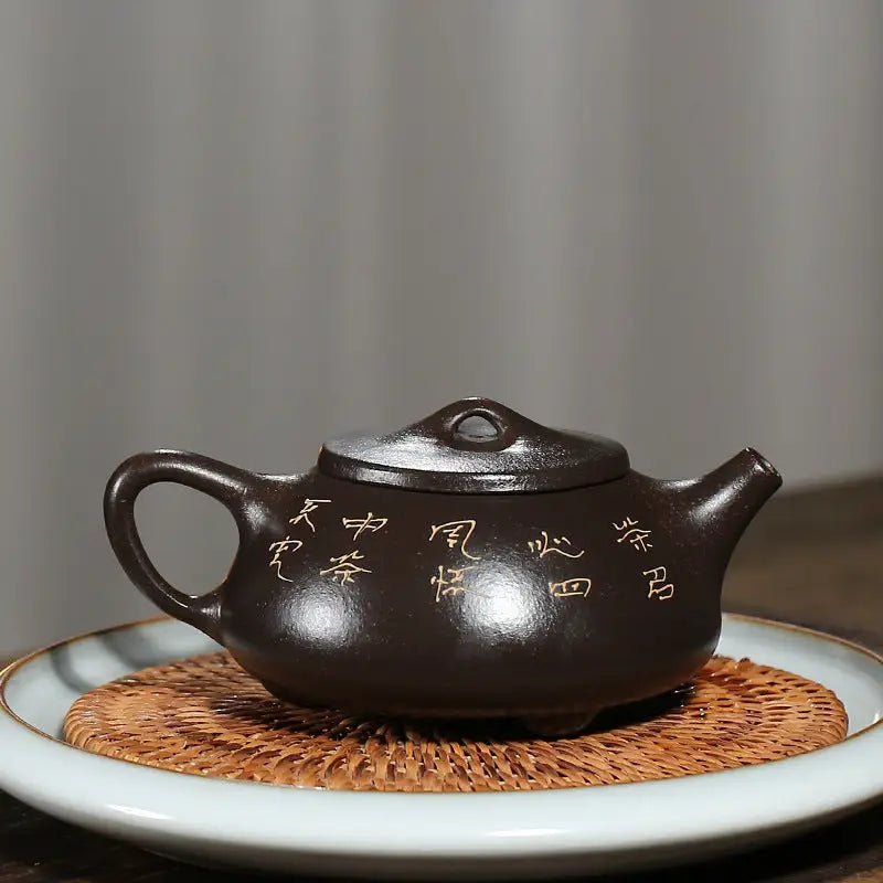 Brown ceramic teapot in Lotus Whisper, crafted from yixing zisha clay with hand-carved lotus