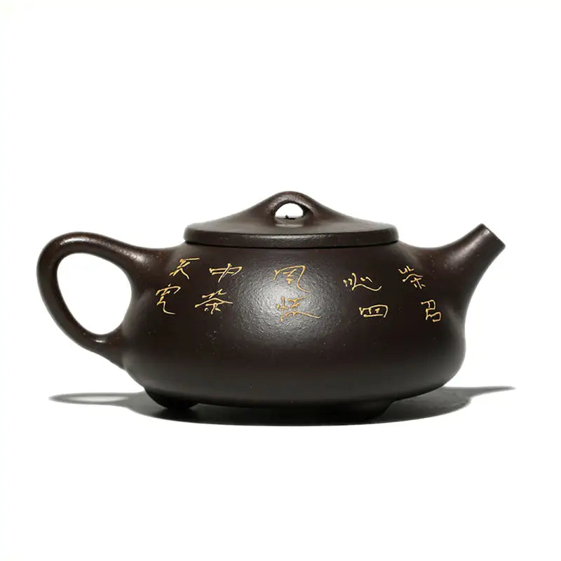 Brown Yixing Zisha ceramic teapot with hand-carved lotus and Chinese calligraphy