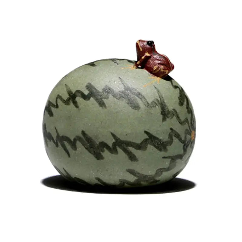 Lucky Melon Hopper spouting frog teapot figurine atop watermelon-shaped object for tea pets guide