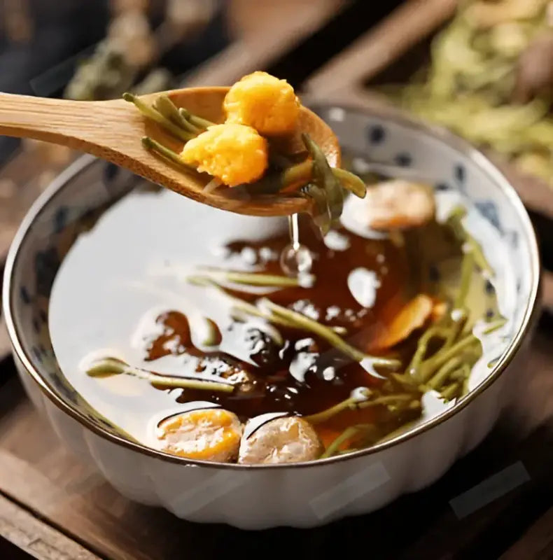 Bowl of herbal tea with honey for sore throat remedy and respiratory inflammation relief