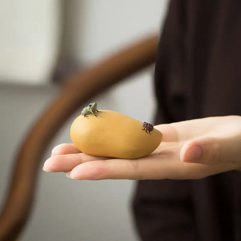 Yellow mango with miniature frog and beetle tea pet, perfect for charming tea and feng shui