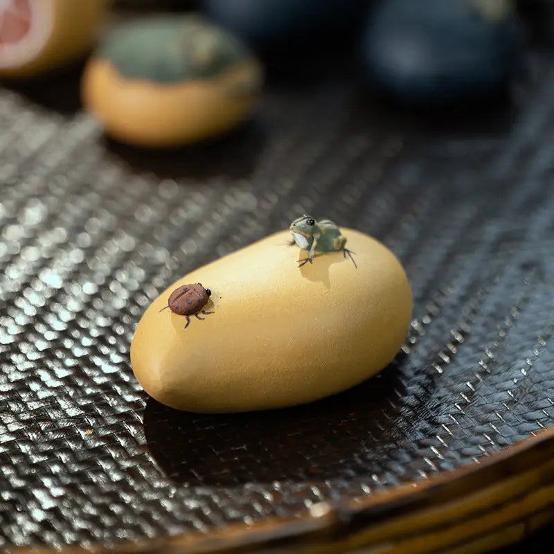Yellow mango with frog and beetle tea pet, perfect for charming tea and feng shui