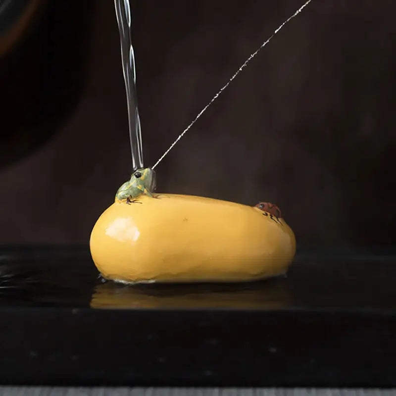 Yellow frog figurine watering tea pet for charming tea and feng shui decor