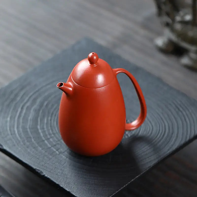 Red-brown ceramic Yixing teapot from Modern Simplicity made of red clay