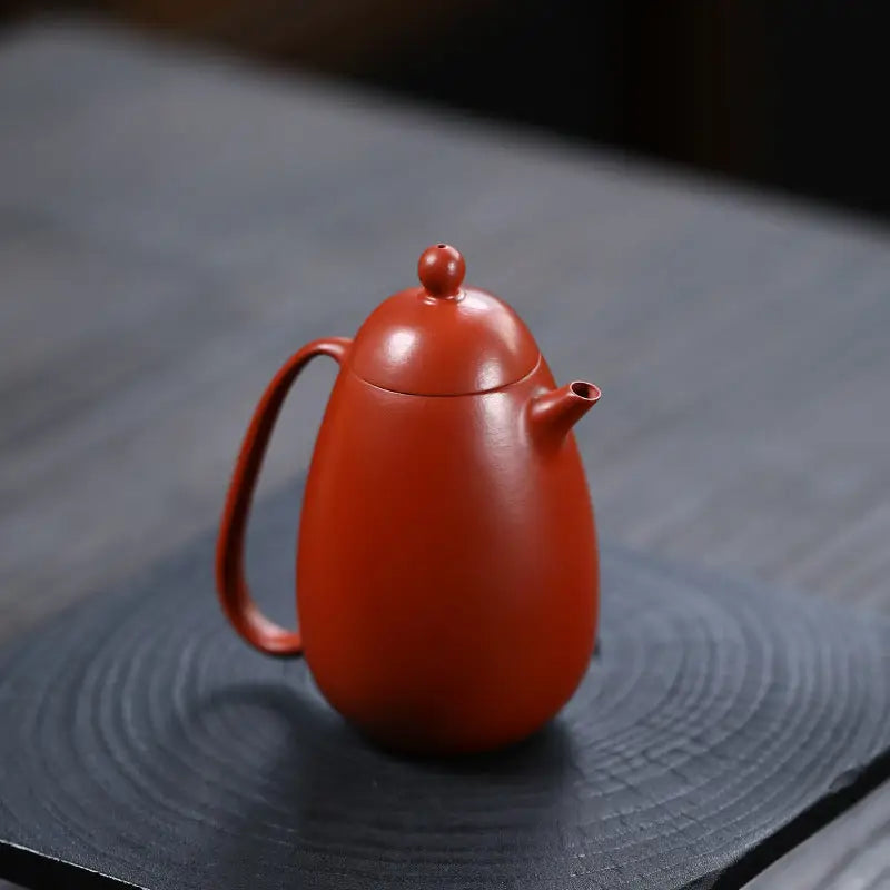 Red-brown ceramic Yixing teapot from Modern Simplicity made of red clay