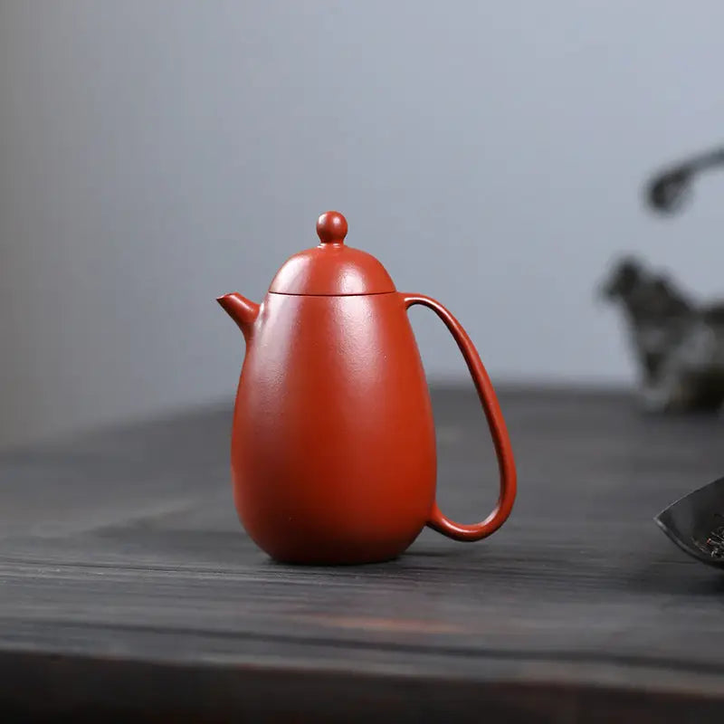 Red-brown Yixing teapot from Modern Simplicity made of red clay for elegant tea brewing