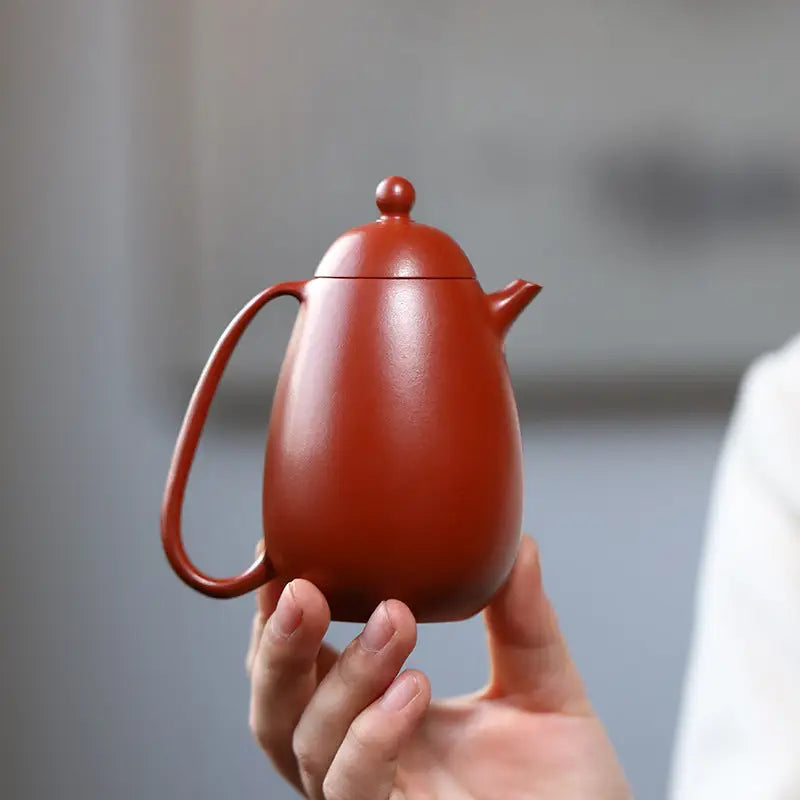 Red-brown ceramic teapot from Modern Simplicity, crafted with red clay for a yixing teapot look