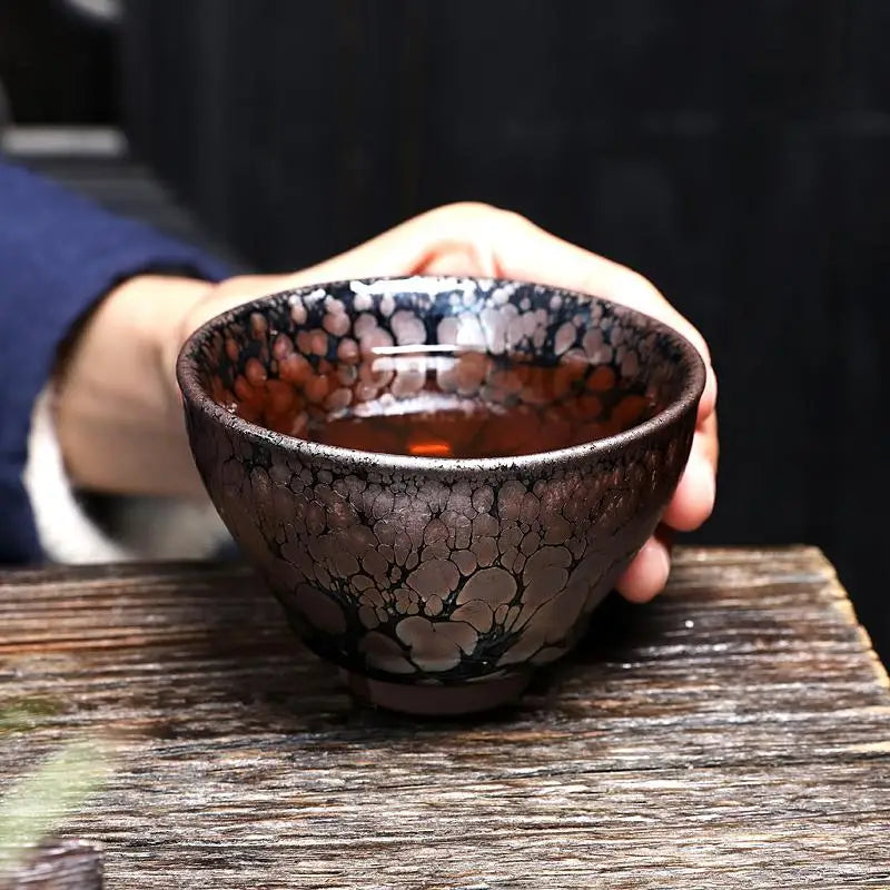 Dark patterned teacup from Molten Jian Zhan Tenmoku ceramics for gongfu tea brewing