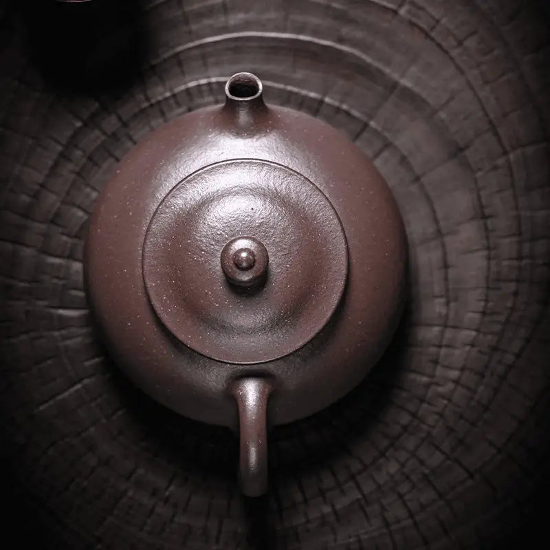 Brown ceramic teapot from Moon Drop for yixing purple tea rituals