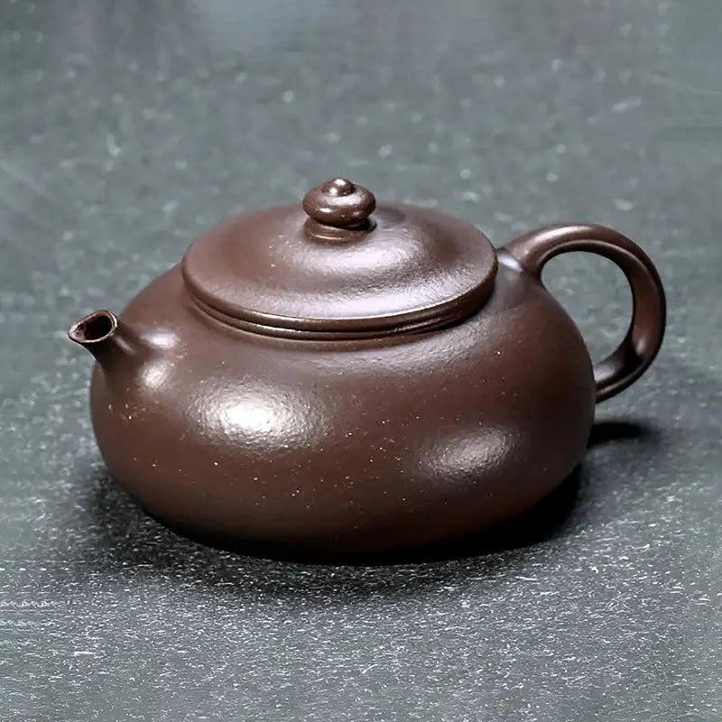 Brown ceramic teapot from Moon Drop for authentic Yixing purple tea rituals