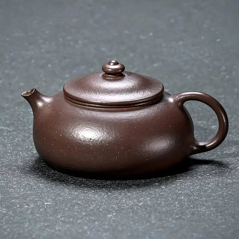 Brown ceramic teapot from Moon Drop collection for yixing purple tea rituals