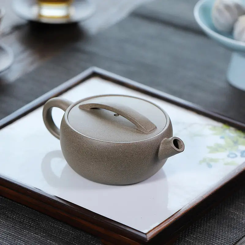 Round brown ceramic Moonbridge harmony teapot with raised handle Yixing Zisha Harmony Yixing