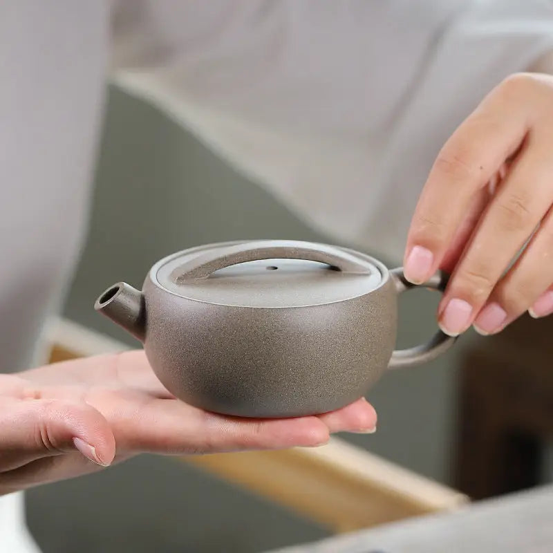 Small gray-brown ceramic Moonbridge Harmony Teapot with raised handle Yixing Zisha harmony Yixing