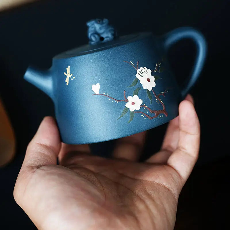 Blue ceramic teapot with floral design from Moonlit Guardian featuring White Plum Artwork