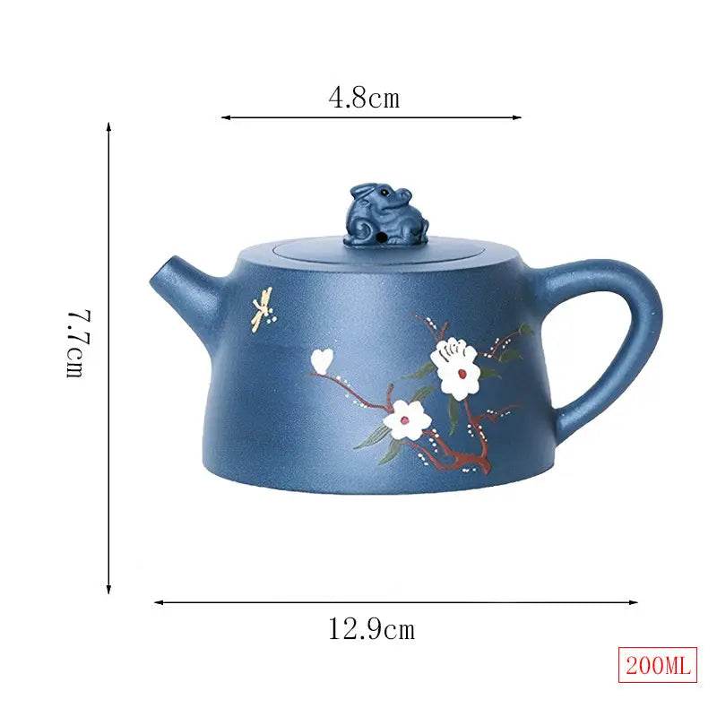 Blue ceramic teapot with floral design from Moonlit Guardian featuring White Plum artwork