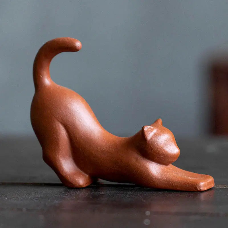 Brown clay cat figurine stretching from the Morning Stretch tea pet guide in Yixing Zisha clay