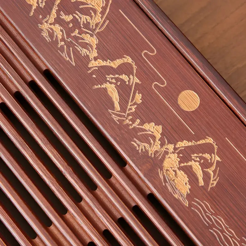 Wooden tea tray with engraved landscape showcasing Mountain Flow bamboo gongfu design