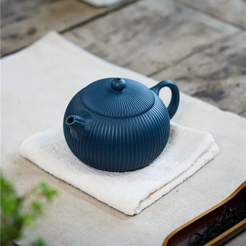 Blue ribbed ceramic teapot with vertical ridges from Not Suitable collection
