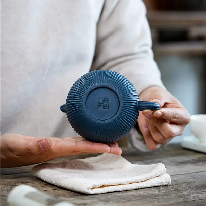 Blue ribbed ceramic cup from Not Suitable featuring midnight ripple vertical ridges