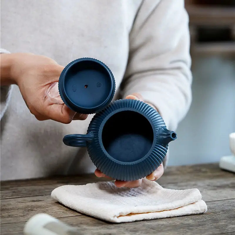 Blue ceramic yixing zisha teapot with midnight ripple finish and vertical ridges