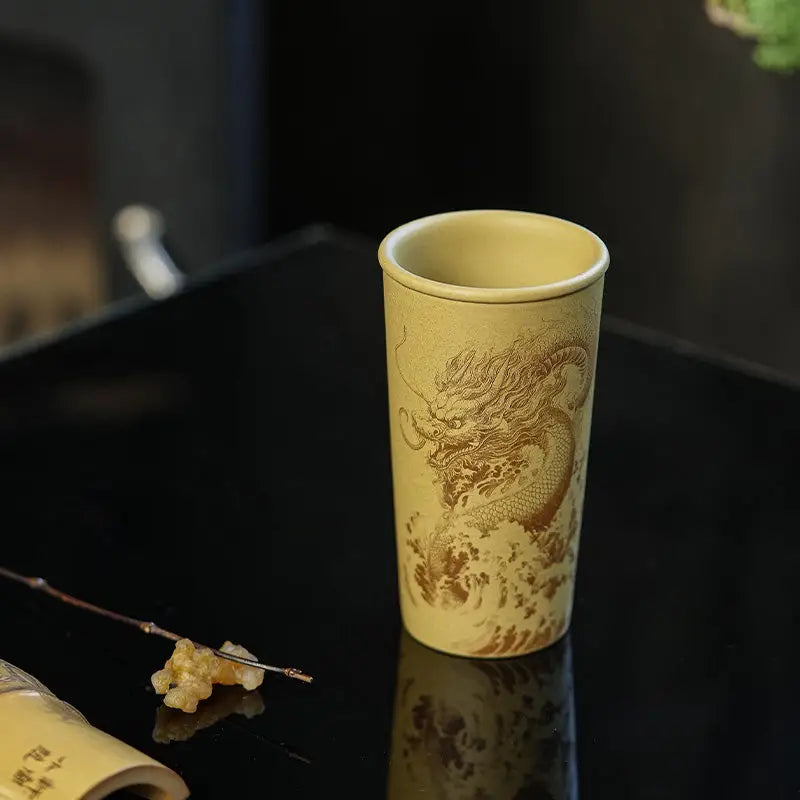 Tall tan Yixing Zisha Ocean Dragon teapot with intricate dragon design
