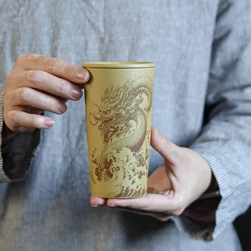 Dragon-engraved ceramic tumbler from Ocean Dragon collection featuring Yixing Zisha teapots