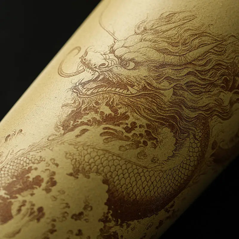 Engraved ocean dragon design on Yixing Zisha teapots showcasing intricate craftsmanship