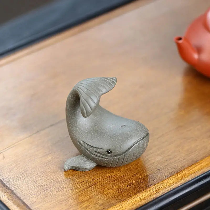 Gray ceramic whale figurine from Ocean Whisper, ideal as a whale tea pet or Yixing Zisha clay guide
