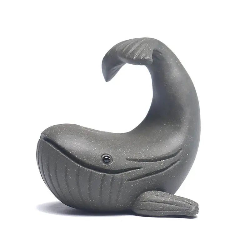 Gray ceramic whale figurine from Ocean Whisper, perfect as a whale tea pet and yixing Zisha clay guide