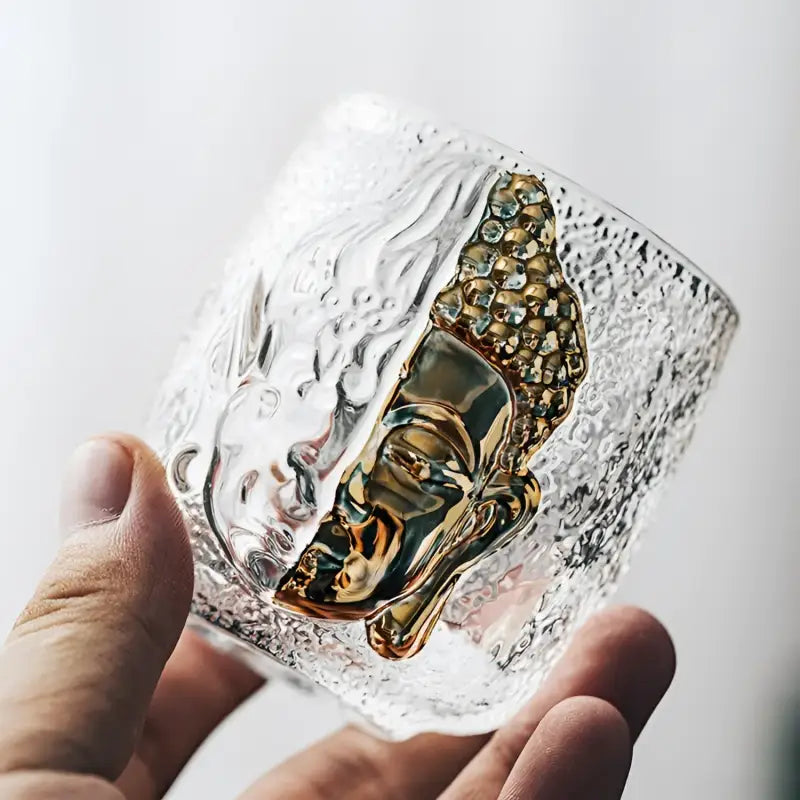 Textured glass with golden Buddha displaying spiritual symbolism in the One Thought crackle glass teacup