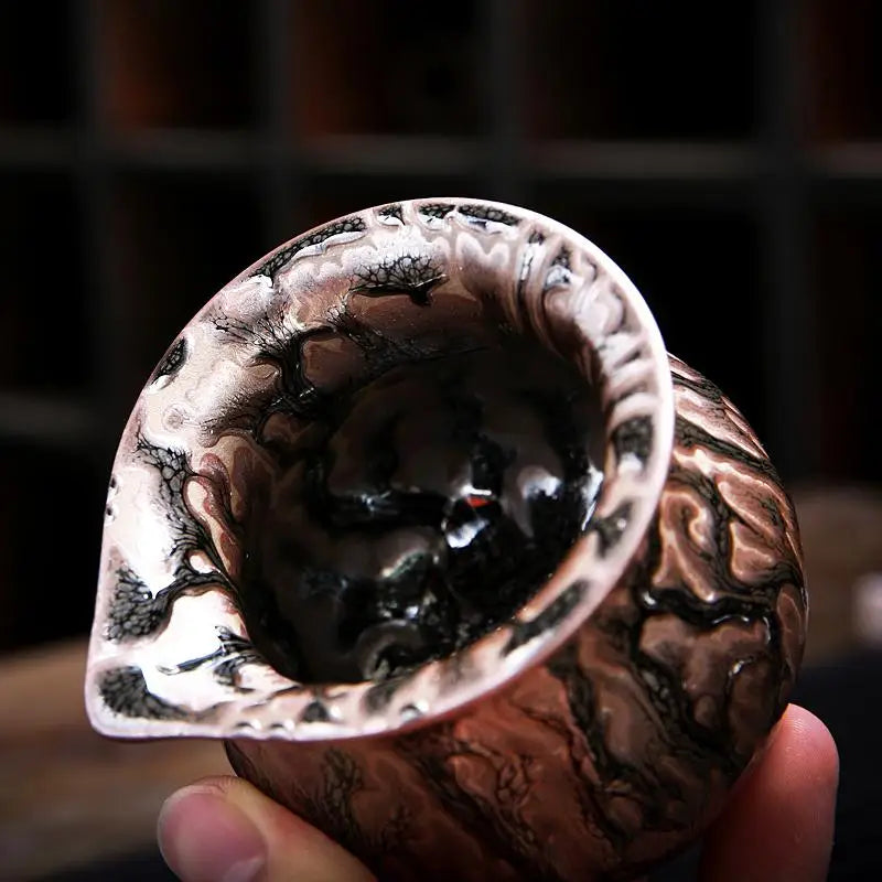 Marbled ceramic cup with spout from Oni Tea Set for tea brewing and serving