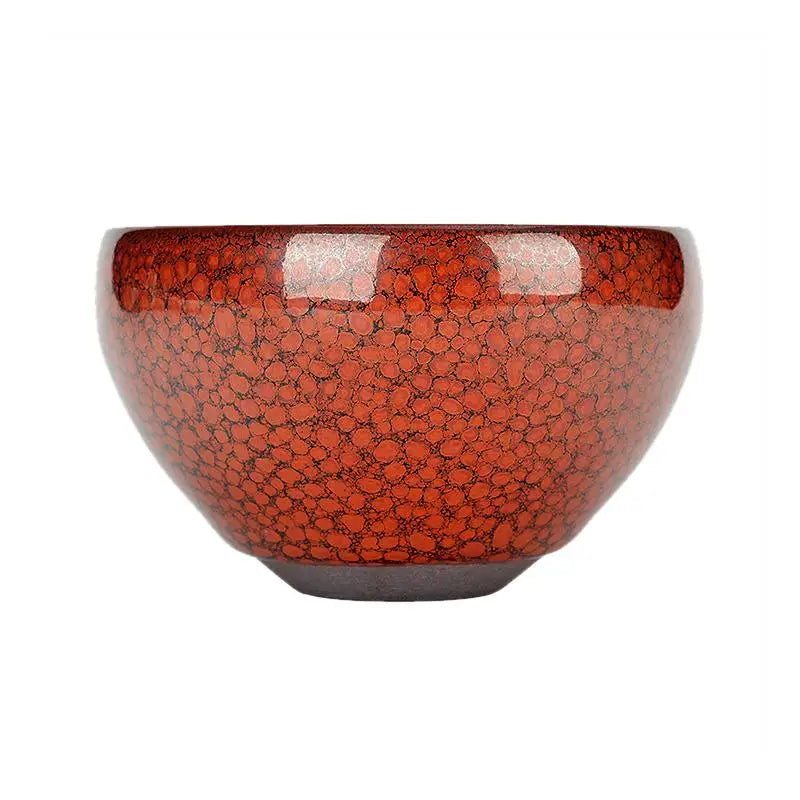 Red ceramic bowl with speckled pattern showcasing jian zhan style from Jianyang Jian Zhan, burnt orange accent