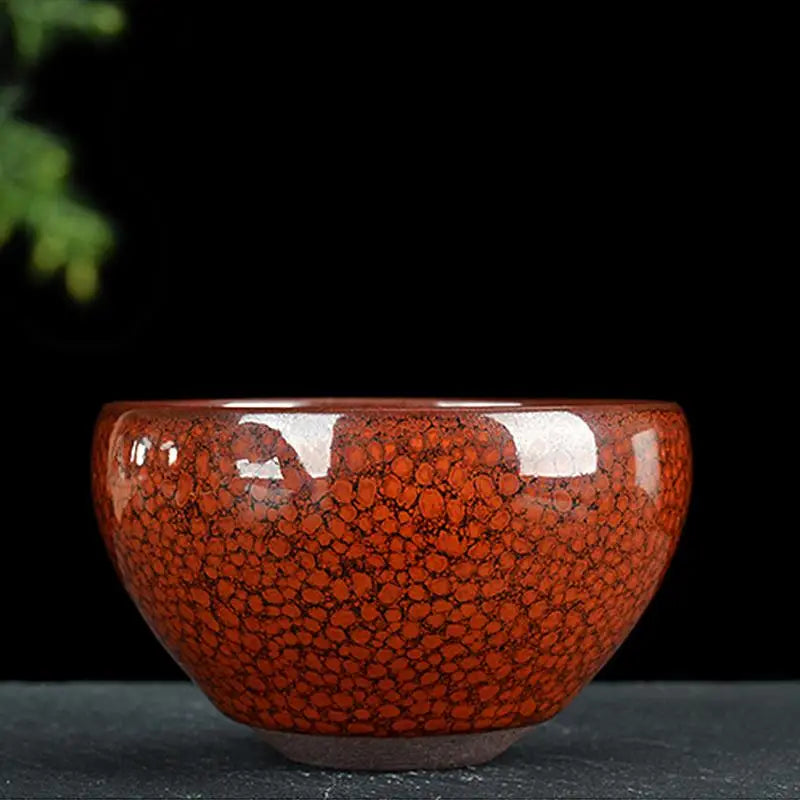 Red speckled ceramic bowl from Jian Zhan collection in burnt orange color displayed in Orange product